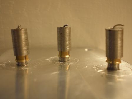 Outer housing caps over springs and sheaths