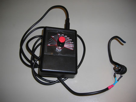 The finalized prototype. The ear attachment is attached to a metronome circuit which is inside the case. The tick-mark scale allows the user to change the tempo by adjusting a potentiometer.