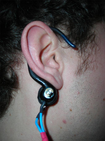 The adjustable ear attachment holds a miniature solenoid capable of delivering a concise, tactile tempo behind the ear of the musician.