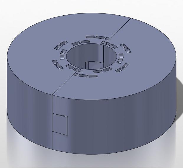 The ring clamp halves fit together like puzzle pieces.  Both halves are identical.  One side has an extrusion that fits into a cut on the opposite side.  As an added form of security, we created holes which pass through both sides where a pin can be placed to lock the parts in place.  These holes proved to be redundant, as the ring clamp halves fit together quite tightly.