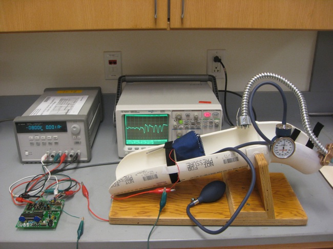 The final design prototype: includes a sensor, circuit, inflatable cuff, stabilizing system, oscilloscope and power supply