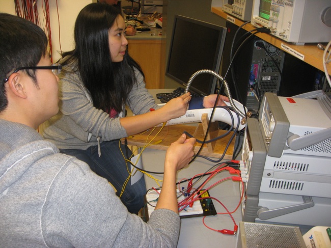 Henry Hu inflates the cuff for Clara Chow.
