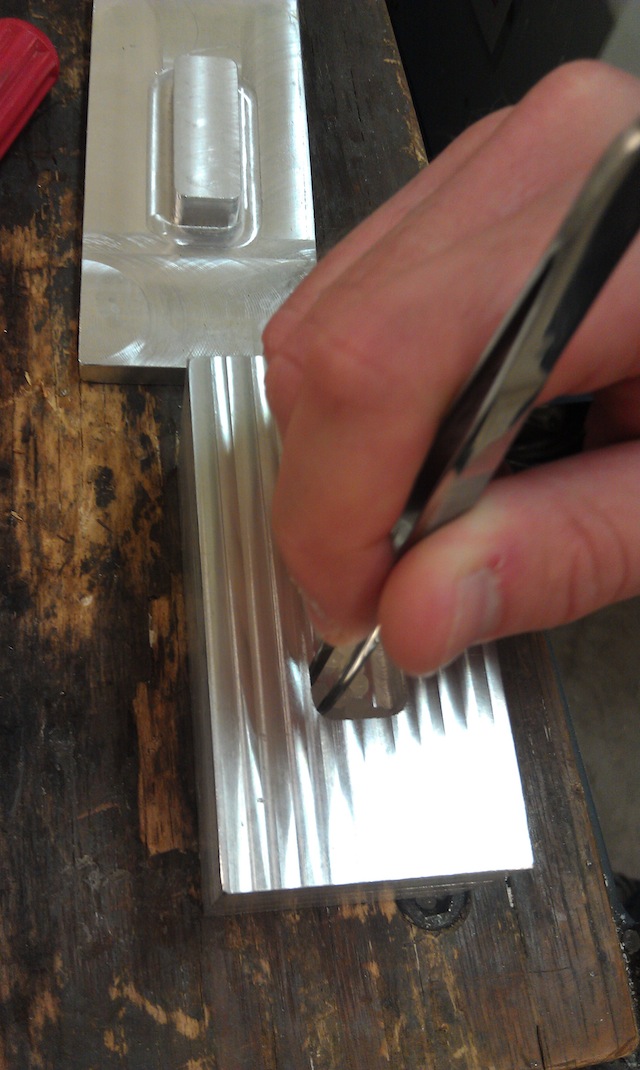 Placing material in the mold to make a sheet.