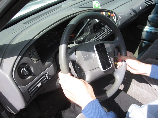 The device currently used by the client.  This device rotates as he turns the wheel, and our goal is to build a device that will remain stable while turning the wheel.