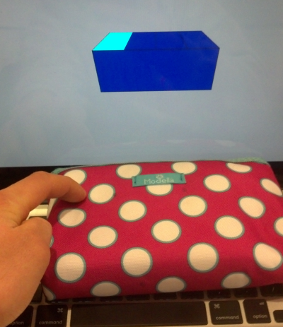 The device can be implanted into various objects for users to interact with. In this case, the object is a makeup bag.