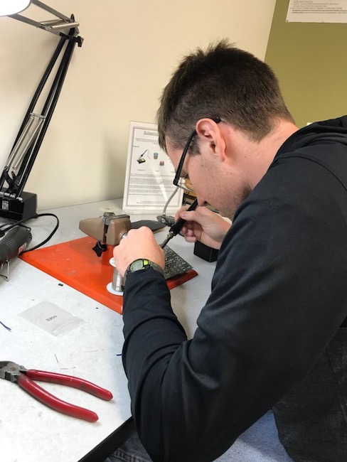 Owen is soldering