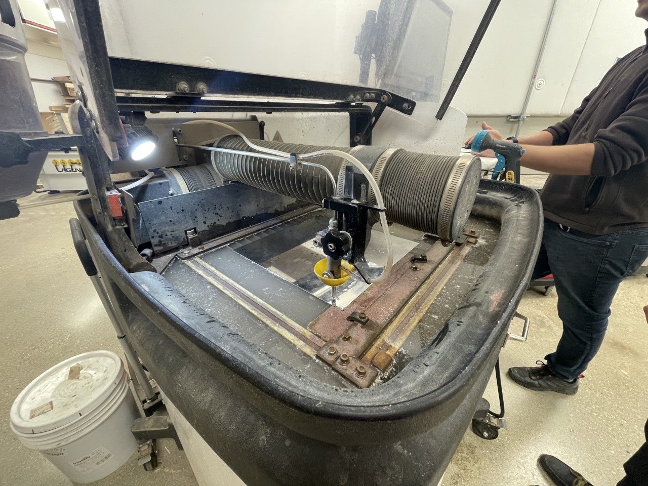 Positioning the Water Jet to cut the corner damper case.