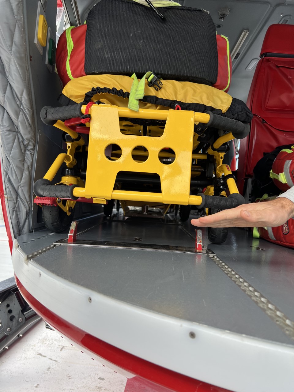 Gurney locked into the helicopter. This is also where the sled with the incubator would sit.