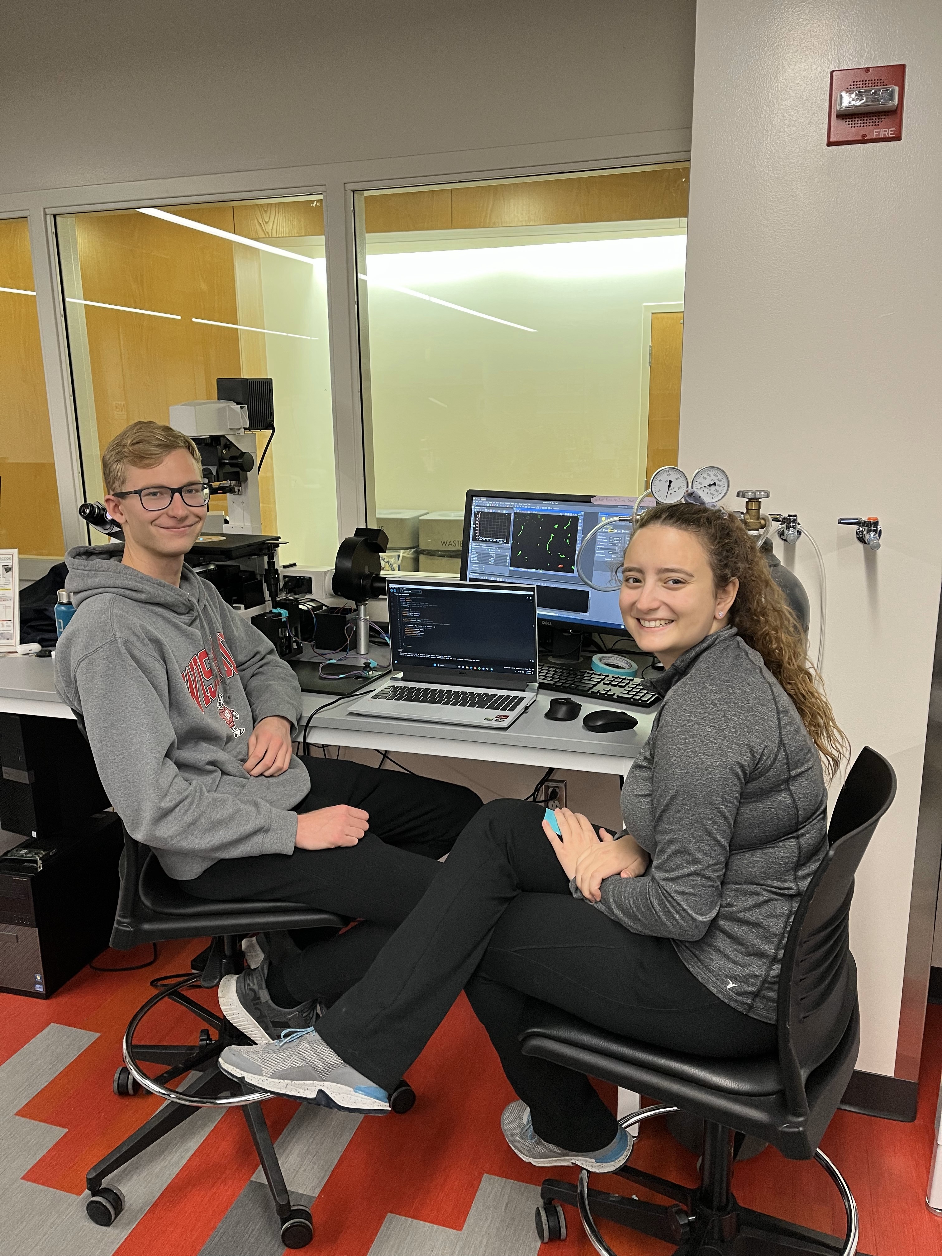 Photo of Nick and Julia conducting testing procedures