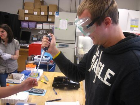 Jeff is pipetting amounts gel onto slides to be exposed to UV radiation