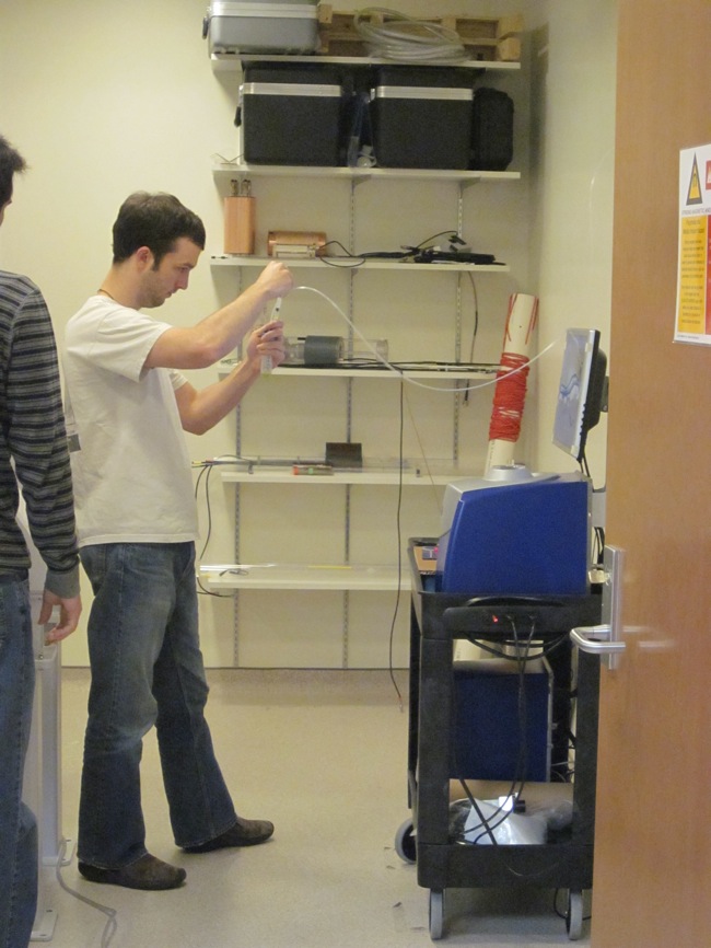 Jeremy Gordon, one of Dr. Fain's graduate students, obtaining the hyperpolarized C-13 solution to be injected into a laboratory mouse for MR scanning and data collection.