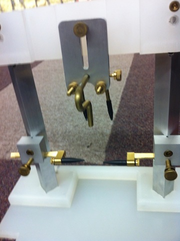 Prototype of current head holder device with ear bars.